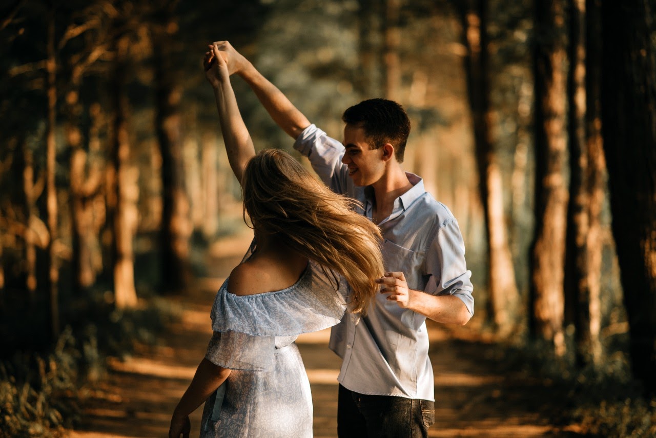 Couple dancing in the forest