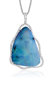A triangular shaped blue opal surrounded by a halo of diamonds on a white gold chain by Simon G. in their fashion jewellery collections