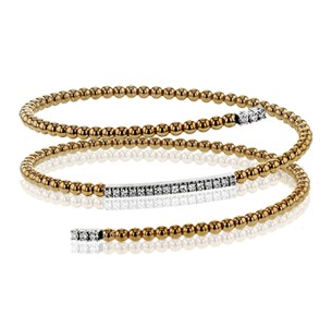 A precious metal beaded design to this wrap style cuff bracelet with diamond details